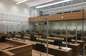 Image from inside Manchester super courtroom showing seats and public gallery