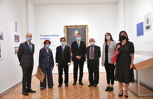 A group of people posing in an exhibit