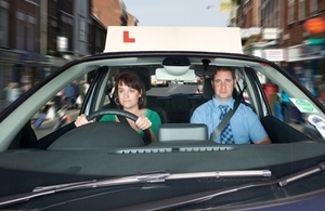 Learner driver and instrutor in car