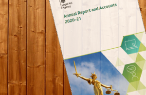 Cover image of Legal Aid Agency Annual Report and Accounts 2020-21 placed on wood-panelled backdrop