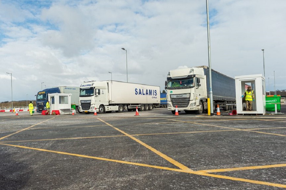 Large lorries are parked in a haulier testing site at Sevington Kent.