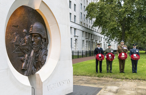 Military personnel with wreaths at the Iraq and Afghanistan Memorial