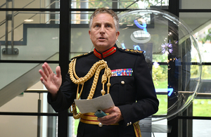 General Sir Nick Carter, Chief of the Defence Staff in military uniform stands at a podium.