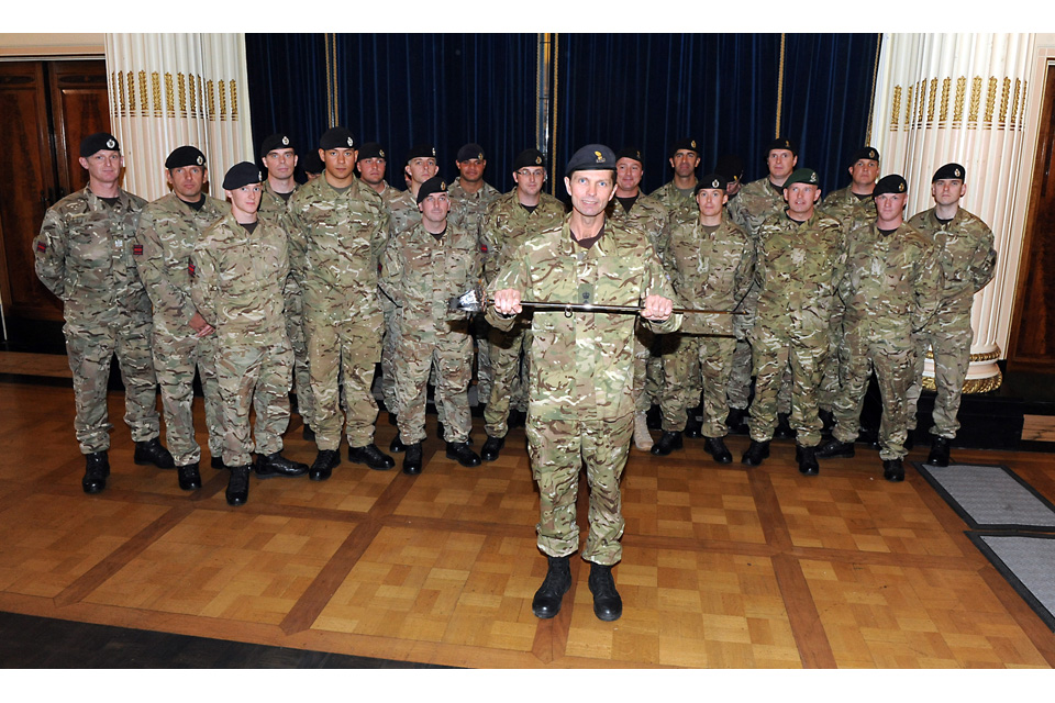 Lieutenant Colonel Tony Tait holds the Firmin Sword of Peace