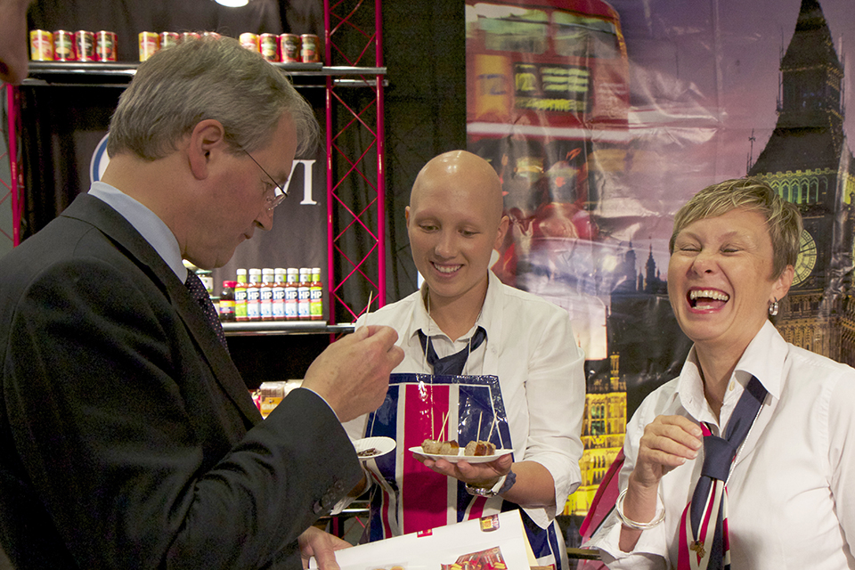 Owen Paterson tries the food samples from British companies.