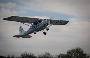 Image depicts the Ikarus C42 microlight in the air.