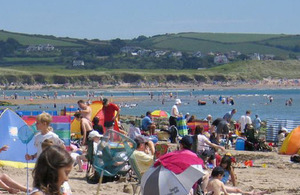 Sunny beach packed with people