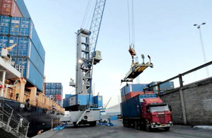 Photograph of a ship being loaded