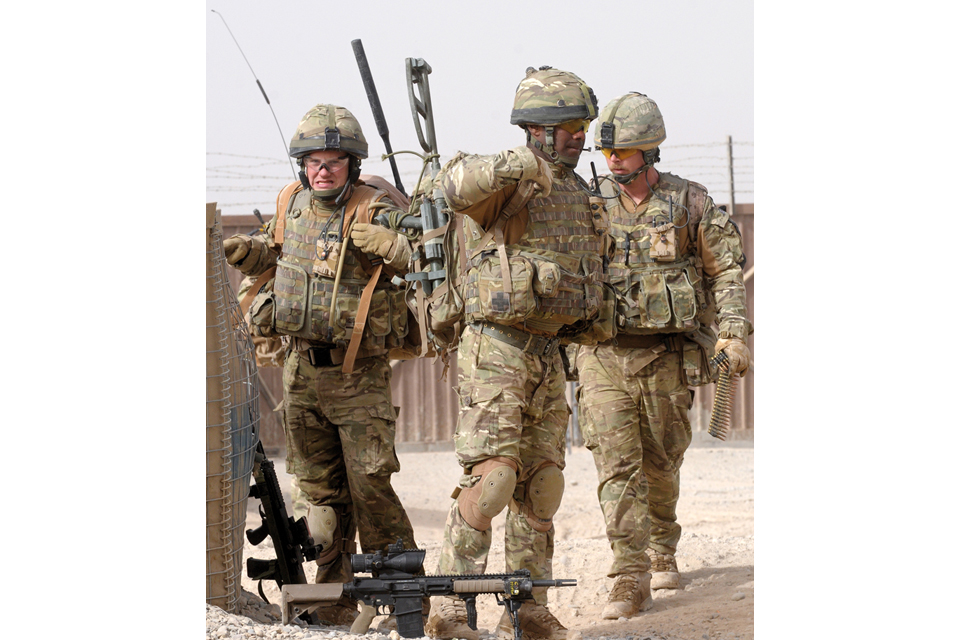 Soldiers prepare to go out on patrol