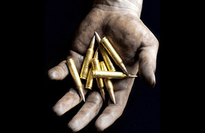 5.56mm rounds being held in the hand prior to loading into a magazine (library image) [Picture: Petty Officer (Photographer) Sean Clee, Crown copyright]