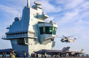 Merlin Mk2 Helicopter takes off from the flight deck of HMS Queen Elizabeth for the final time during CSG21