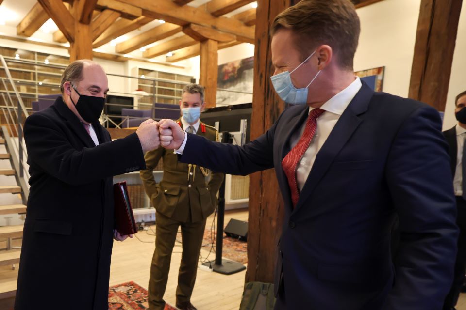 The Defence Secretary bumping fists with the Danish Foreign Minister. 