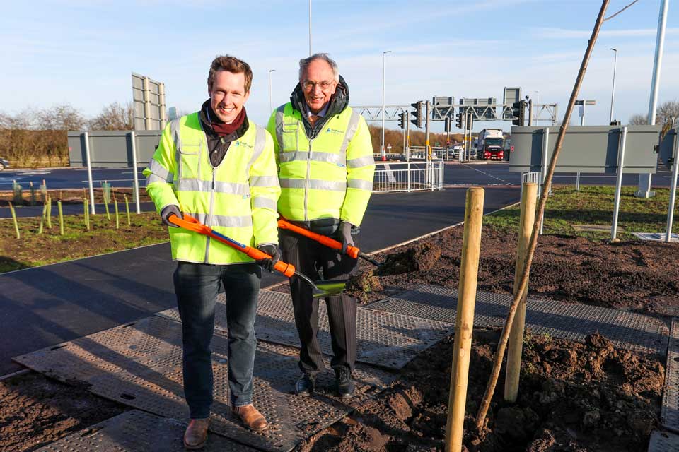 MPs Tom Pursglove and Peter Bone with shovels standing next to one of the final trees planted in the Chowns Mill roundabout scheme