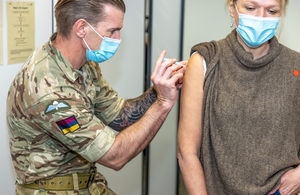A member of the Armed Forces administers a Covid-19 vaccine in Northampton (MoD Crown Copyright)