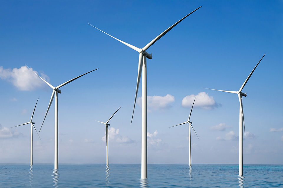 A photograph of off-shore wind turbines
