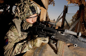 Lieutenant Adam Durant, Royal Artillery, mans a sangar in the Upper Gerenshk Valley