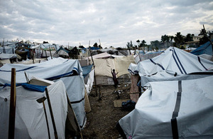 Photograph of a child near temporary tents in Port au Prince, Haiti