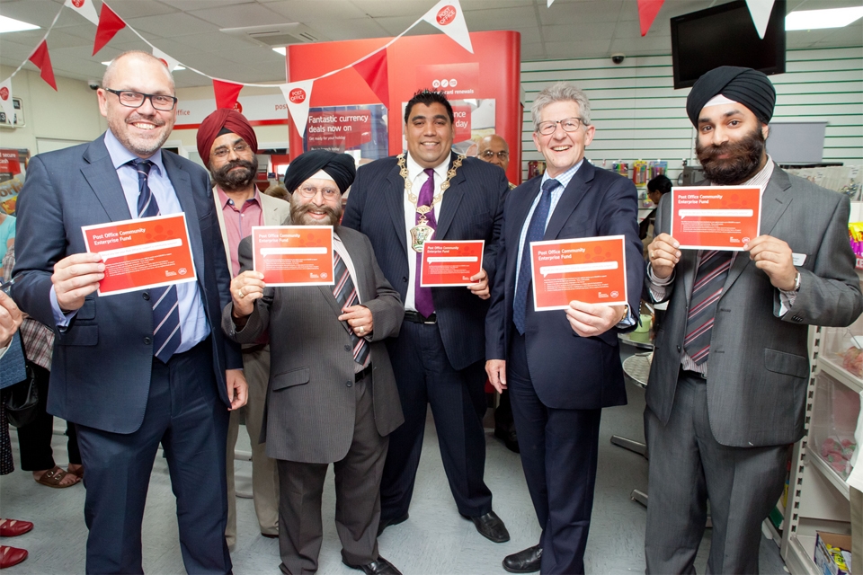 Communities Minister Don Foster with staff of the Wood St Post Office, Walthamstow