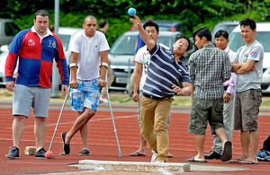 Soldiers have a go at the shot put during the 2-day event to discover Paralympic talent of the future [Picture: Richard Watt, Crown copyright]