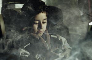 boy in car full of smoke