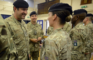 Colonel Adrian Thurgood presenting members of 159 Supply Regiment with their Operational Service Medals [Picture: Sergeant Russ Nolan RLC, Crown copyright]