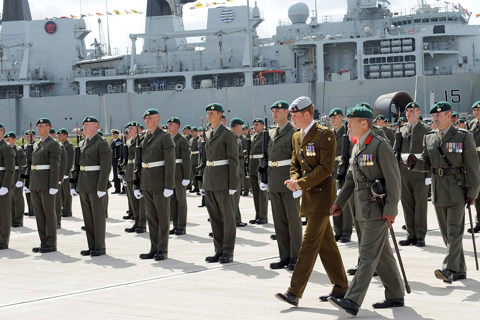 Prince Harry reviews the parade of 1 Assault Group Royal Marines personnel
