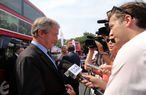 Minister Owen Paterson interviewed in front of the GREAT New Bus for London