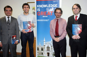 Ambassador Jon Benjamin with three of the departing scholars.