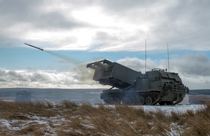 A British multiple-launch rocket system fires a missile in an exercise