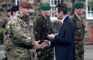 Councillor Carl Crompton presents medals to soldiers of 42 (North West) Brigade in Preston