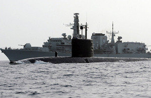 Trafalgar Class submarine HMS Turbulent is pictured in front of Type 23 frigate HMS St Albans during an anti-submarine exercise in the Gulf of Oman