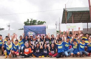 The Lone Buffalo Foundation teams join with Ambassador Philip Malone following the football matches.