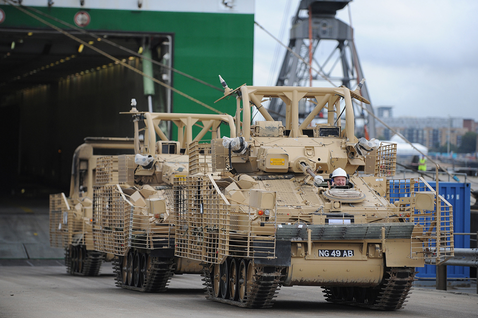 Unloading vehicles being returned to the UK from Afghanistan 