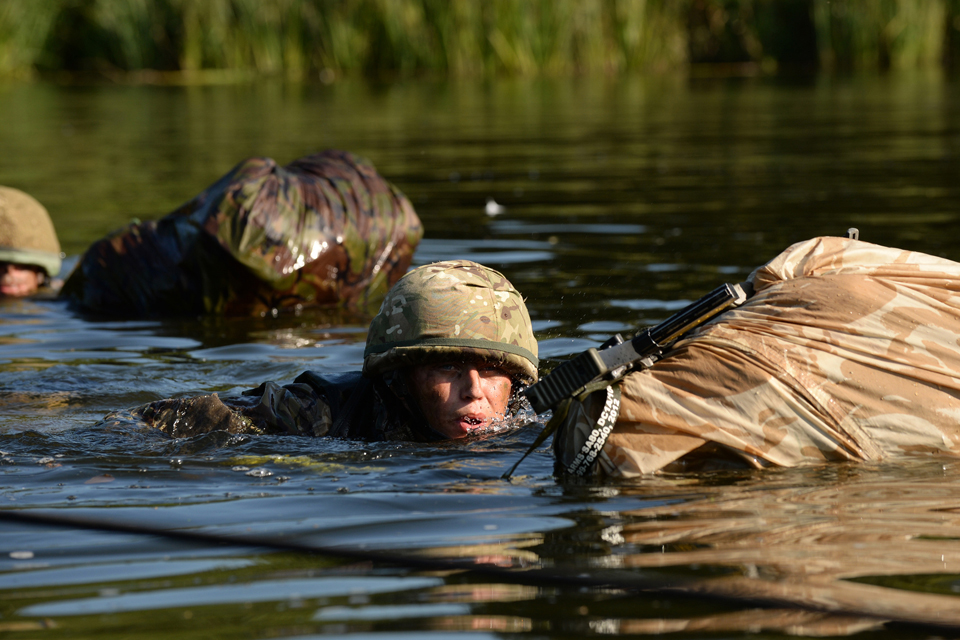 Soldier crossing a river