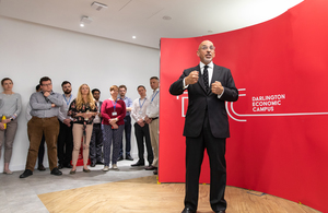 Chancellor Nadhim Zahawi speaks in front of a red screen with the Darlington Economic Campus logo