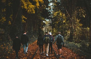 Young people walking through a forest