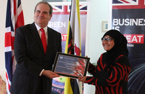 British High Commissioner designate, Mr David Campbell presenting Fatin Arifin with her award certificate.