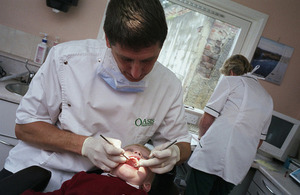 Dentist examining young child