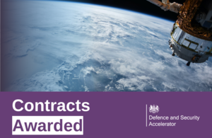 An image of a space satellite floating above the earth. Text at the bottom reads "Contracts Awarded"