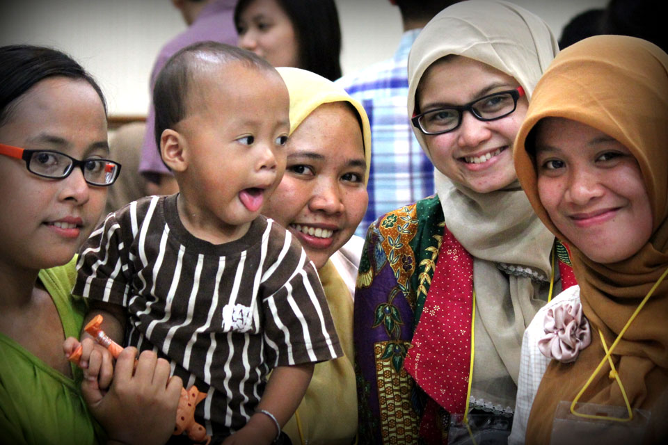 Happy Indonesian women with baby