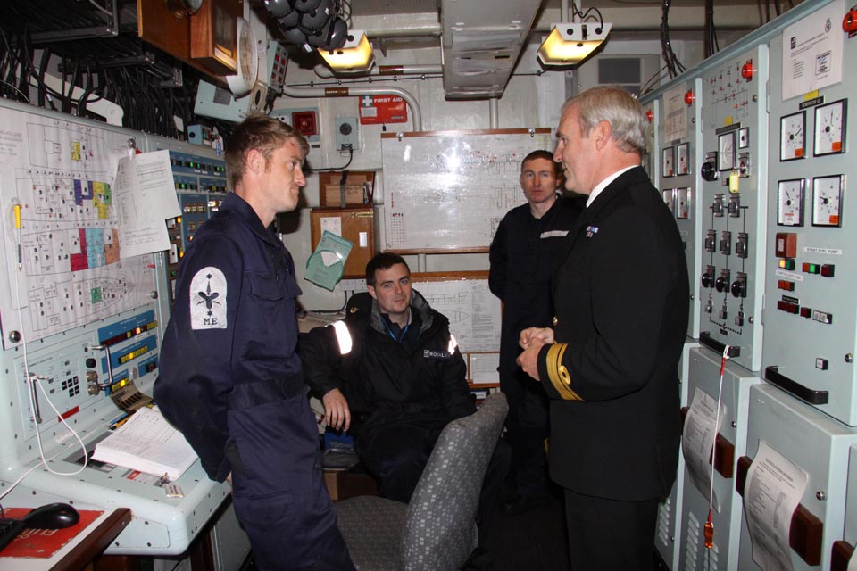 Vice Admiral Ian Corder talks with a seaman