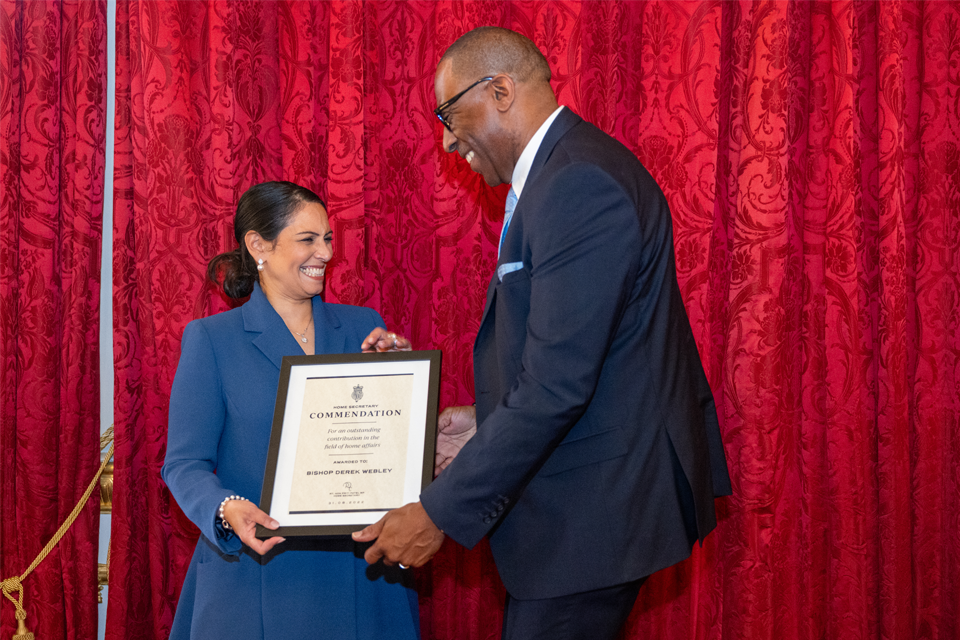 Bishop Webley receives his award