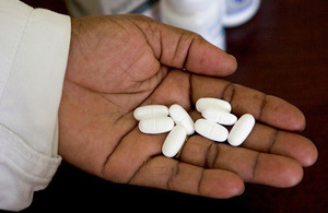 The clinical officer at Ray Drop-In Centre demonstrates the Nevirapine they can provide to clinic clients. Picture: Nell Freeman / International HIV/AIDS Alliance