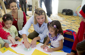 Justine Greening with Syrian refugee children. Picture: Scott Hornby/The Sun