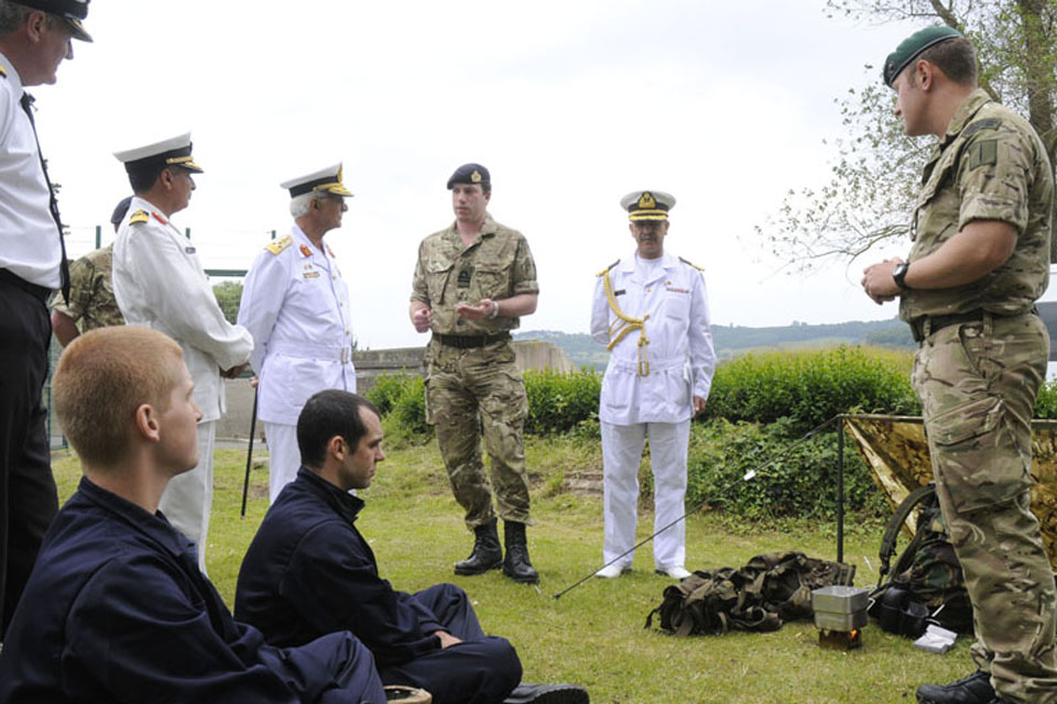 Libyan Navy visitors are briefed on the field craft skills provided to new recruits at HMS Raleigh 