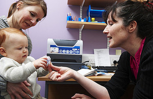 Mum with a baby having a health check up