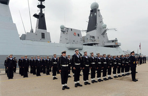 Members of HMS Duncan's ship's company line up on the dockside at the ship's commissioning ceremony [Picture: Leading Airman (Photographer) Maxine Davies, Crown copyright]