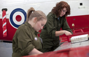 Young people repairing an aeroplane