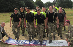 Stephen Cooper, Director of the Parachute Regiment Charity (left), and Captain Dominic Burn (right) at the start of a test run by 2 PARA soldiers around the Colchester PARAS' 10 course