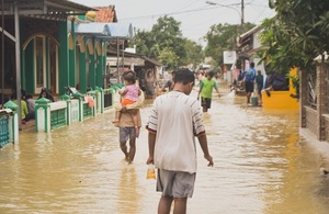 People Walking in Floodwater